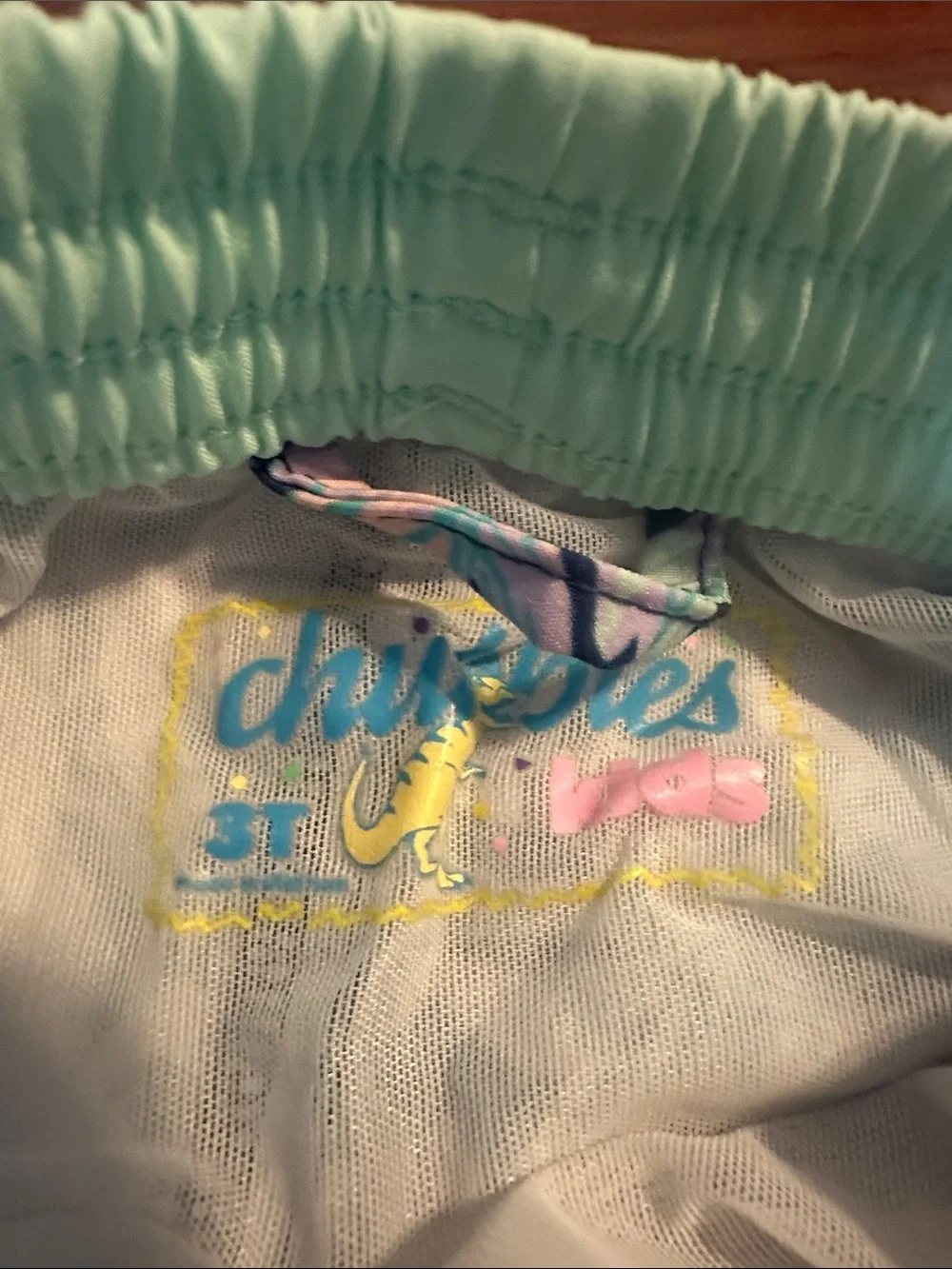 chubbies Kids Navy Floral Swim Trunks with Mint Waistband